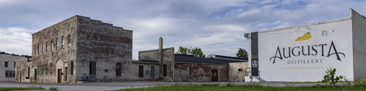 Archival 2022 view of Augusta Distillery’s historic facade and painted exterior sign.